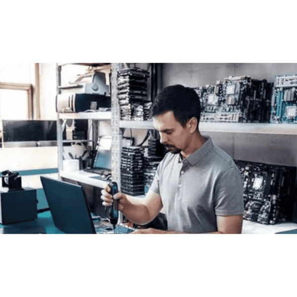 BOSCH GO Cordless Screwdriver: Electronics Repair on Motherboard. Man Using Tool for Computer Maintenance.