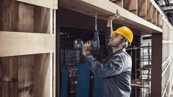 Bosch GSB 18V-50 Impact Drill: Construction Worker Drilling, Cordless Power Tool