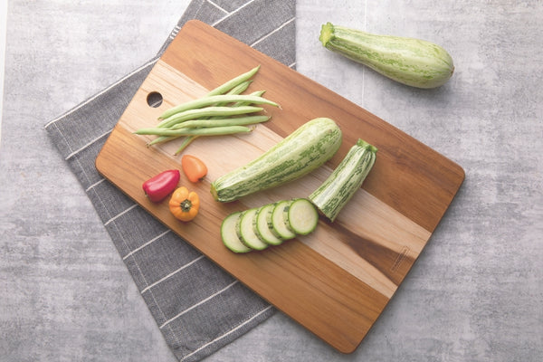 Tramontina Teak Cutting Board with Vegetables: Zucchini, Peppers, Green Beans. Kitchen Prep.