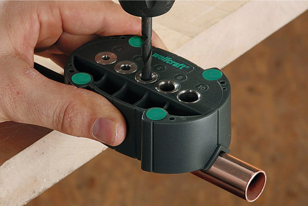WOLFCRAFT Accumobil Drill Guide: Precision Drilling with V-Groove and Rubber Buffers. Hand using drill.