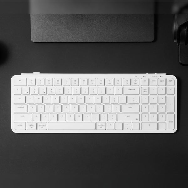Keychron B2 Pro Ultra-Slim 96% Wireless Keyboard - Ivory White. Compact keyboard on a black desk.