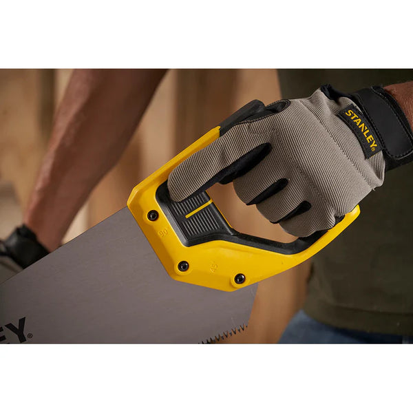 Stanley JETCUT Hand Saw: Carpenter using a woodworking saw with Stanley work gloves for precision cutting.