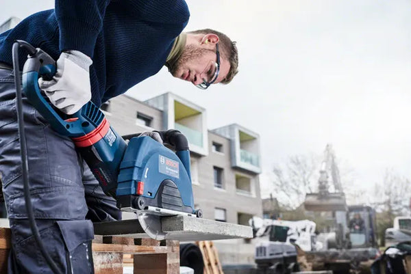 Concrete Saw: Construction Worker Cutting Concrete Slab with Bosch Diamond Blade Power Tool